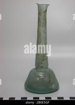 Bottle of light green glass with flat bottom, conical body and a long, narrow neck. The mouth is damaged., Crockery, glass, H 13 cm, Lebanon Stock Photo