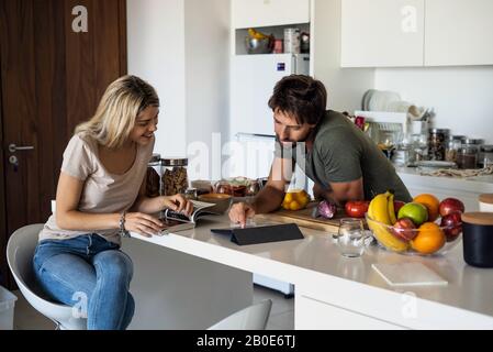 Couple using digital tablet Stock Photo
