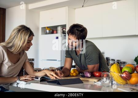 Couple using digital tablet Stock Photo