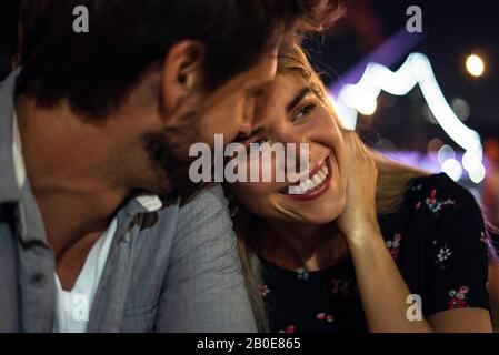 Young couple sitting at outdoor cafe Stock Photo