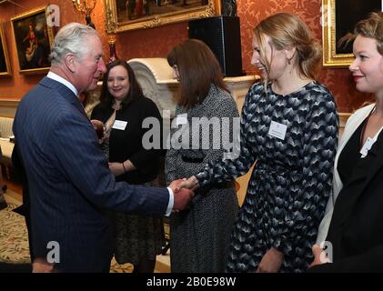 The Prince of Wales shakes hands with Dr. Sarah Phelms of the University of Exeter, who won the prize for broad-based research identifying and combating the environmental dangers of micro and nano-plastics pollution during the presentation of the Queen's Anniversary Prizes for Higher and Further Education at Buckingham Palace, London. PA Photo. Picture date: Thursday February 20, 2020. Photo credit should read: Chris Jackson/PA Wire Stock Photo