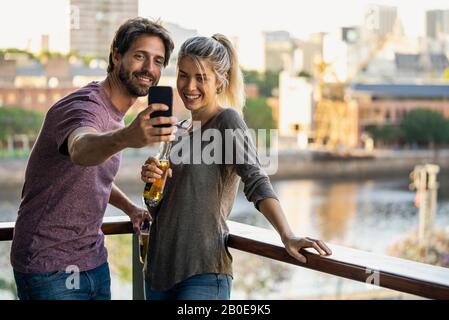 Young couple taking selfie Stock Photo