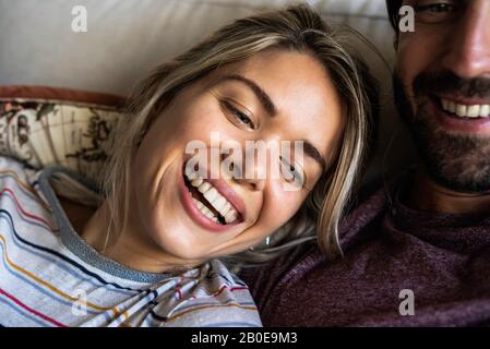 Close-up of wife leaning on husband's shoulder Stock Photo