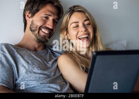 Couple using digital tablet Stock Photo