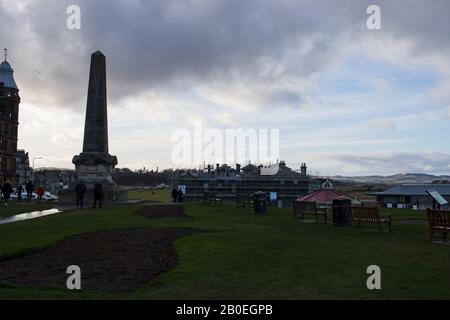ST ANDREWS, SCOTLAND - 17/2/2020 - The Martyr's memorial behind the Old Course, with the R&A undergoing renovation in the background Stock Photo
