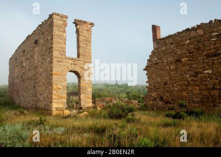 Ruined walls of Mutz Hotel, Elizabethtown ghost town (circa 1870s), New Mexico USA Stock Photo