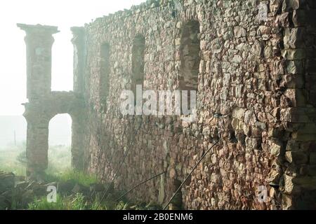 Ruined walls of Mutz Hotel, Elizabethtown ghost town (circa 1870s), New Mexico USA Stock Photo