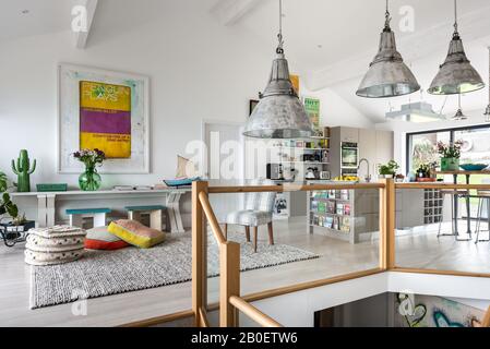 Reclaimed lights in open plan kitchen renovation Stock Photo