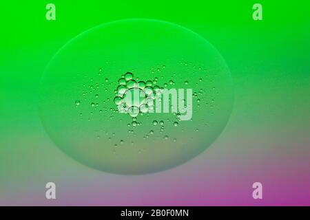 Green paint water bubbles macro abstract background Stock Photo