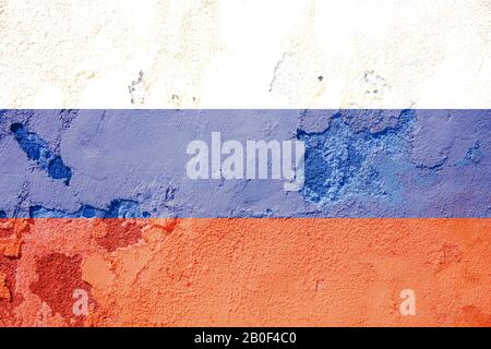 Russia flag on wall. Russian flag painted on a grunge peeled wall. Russia, russian language and culture concept Stock Photo