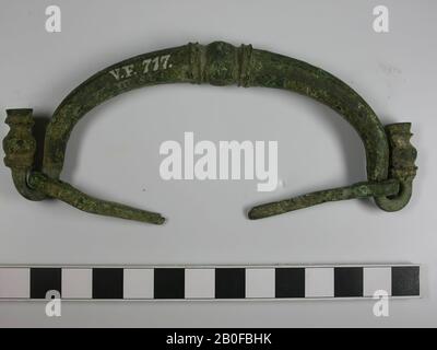Bronze handle of a box or the like. The eye bolts, in which it moved, are both still present., Handle, metal, bronze, 5 x 13.5 cm, roman 15-250, the Netherlands, Utrecht, Bunnik, Vechten, Houtense Vlakte Stock Photo