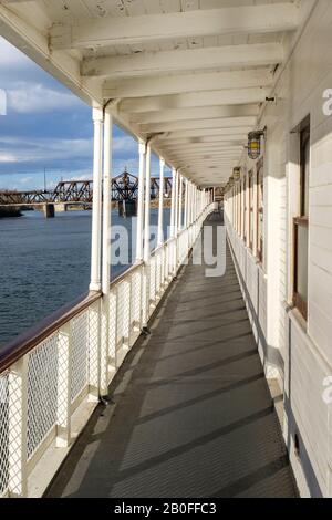 View along the length of the deck walkway aboard the Delta King in historic Old Town Sacramento, California Stock Photo