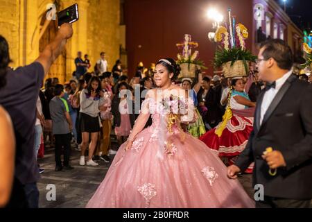 Oaxaca, Mexico - A quinceañera, or a girl's 15th birthday, is celebrated on the streets of Oaxaca. Stock Photo