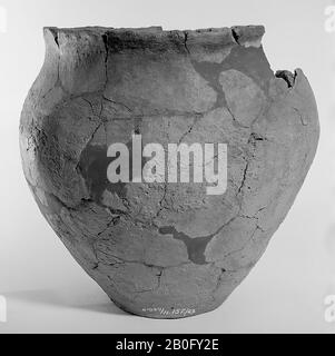 Large Germanic urn of earthenware with serrated edge. Many bondings and additions, part of the edge Stock Photo