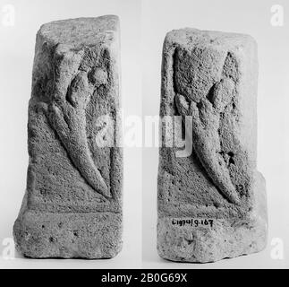 Bottom of an altar. Limestone. A corner has broken out at the top right-hand corner. On the left and right side, the lower part of a curved cornucopia with leaves hanging down in the middle stands on a deepened surface in relief. A plinth runs around the front and sides. The back is undecorated., Cracks in the surface., Altar, fragment, stone, limestone, 27.5 x 29.5 x 11.5 cm, roman 150-250, the Netherlands, Zeeland, Noord-Beveland, Colijnsplaat, Oosterschelde Stock Photo