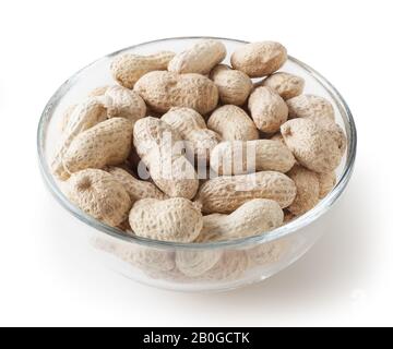 Raw peanuts in glass bowl isolated on white background with clipping path Stock Photo