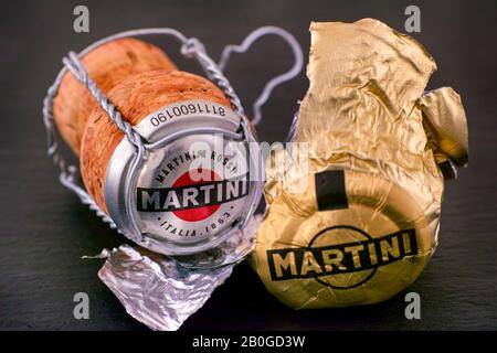 Tambov, Russian Federation - February 14, 2020 Martini Prosecco cork, foil and muselet with cap on black background. Studio shot. Stock Photo