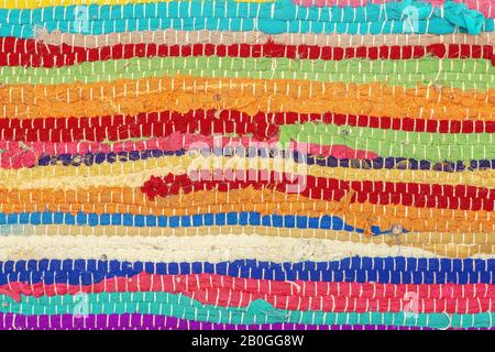 Boho carpet style. Colored carpet background. Handmade rug made from recycled fabric or clothing flaps. Stock Photo