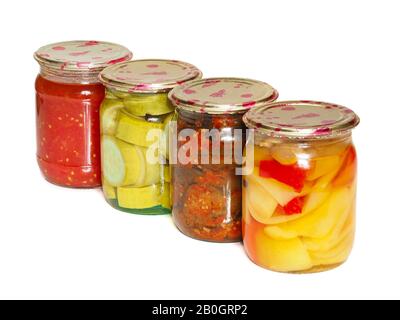 Jars of tasty pickled vegetables on a white background Stock Photo