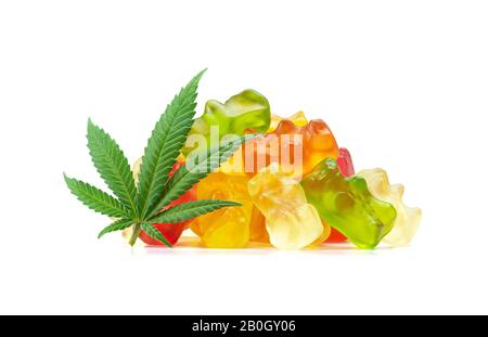 Gummy Bear Medical Marijuana Edibles, Candies Infused with CBD or THC, with Cannabis Leaf Isolated on White Background Stock Photo