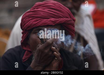 Kathmandu, Nepal. 20th Feb, 2020. A Hindu Sadhu or Holy Man smokes marijuana at the premises of Pashupatinath Temple during the eve of the Hindu festival Maha Shivaratri in Kathmandu on February 20, 2020. Maha Shivaratri is celebrated annually in honour of Lord Shiva. (Photo by Subash Shrestha/Pacific Press) Credit: Pacific Press Agency/Alamy Live News Stock Photo