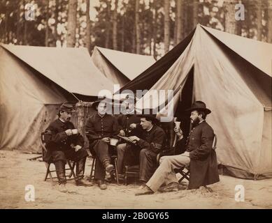 Alexander Gardner, American, 1821–1882, born in Scotland, Civil War Scene: five soldiers sitting among tents, c. 1860–65, Albumen print from glass negative, image: 7 3/16 x 9 3/16 in. (18.3 x 23.4 cm Stock Photo