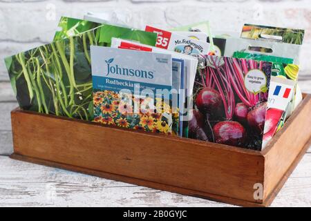 Vegetable and flower seed packets in a wooden box. UK Stock Photo