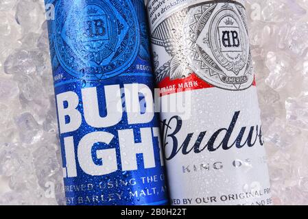 IRVINE, CALIFORNIA - MARCH 21, 2018: Budweiser and Bud Light King Cans on ice closeup. Budweiser and Bud Light are two of the most popular beers in th Stock Photo
