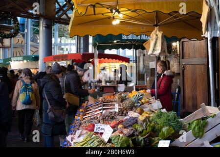 London, UK - November 29, 2019: Fruit and vegetables stand in Borough Market, one of the largest and oldest food markets in London, selective focus. Stock Photo