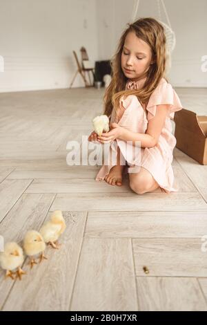 girls playing with ducks for Easter Stock Photo