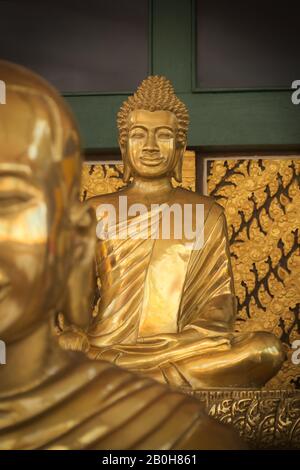Golden statue of a buddhist monk at a temple in Siem Reap, Cambodia. Stock Photo