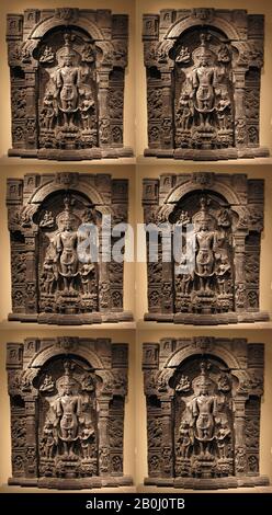 Vishnu with His Consorts, Lakshmi and Sarasvati, India (Bihar or West Bengal) or Bangladesh, Pala period, Date 11th–12th century, India (Bihar or West Bengal) or Bangladesh, Black stone, H. 7 ft. 2 in. (218.4 cm); W. 53 11/16 in. (136.3 cm); D. 1 7/8 in. (30.2 cm), Sculpture Stock Photo