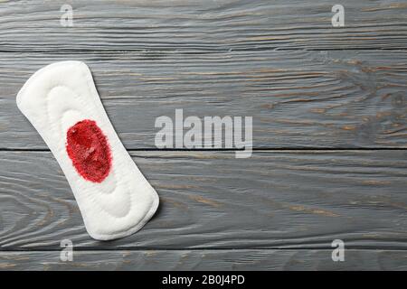 Used sanitary pad isolated on white background, top view Stock