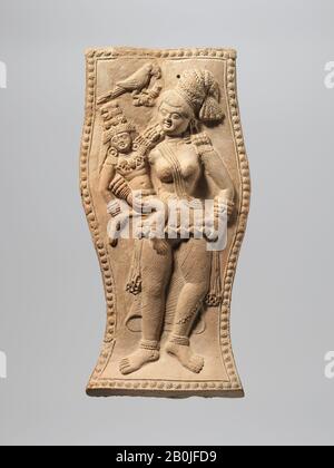 Yakshi Holding a Crowned Child with a Visiting Parrot, India (Bengal), Shunga period, Date ca. 1st century B.C., India (Bengal), Terracotta, H. 9 1/4 in. (23.5 cm); W. 4 5/8 in. (11.7 cm), Sculpture Stock Photo