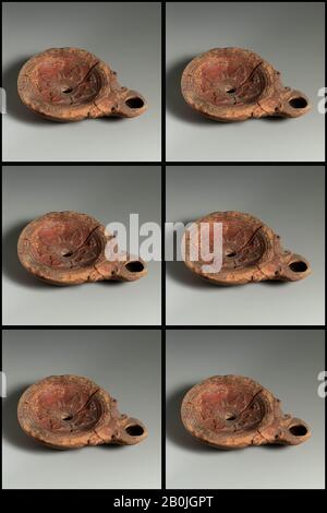 Terracotta oil lamp, Roman, Cypriot, Early Imperial, Date ca. A.D. 40–100, Roman, Cypriot, Terracotta, Overall: 7/8 x 3 5/8 in. (2.2 x 9.2 cm), Terracottas Stock Photo