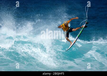Professional surfer Italo Ferreira aerial movements on a wave, Pipeline Beach, North Shore of Oahu, Hawaii, USA Stock Photo