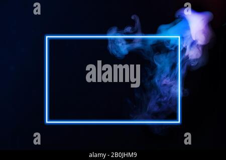 Abstract neon light smoke effect with neon frame on black background. Smoke cloud explosion. Stock Photo