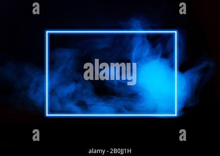 Abstract neon light smoke effect with neon frame on black background. Smoke cloud explosion. Stock Photo