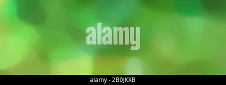 unfocused landscape format background graphic with moderate green, pastel green and forest green colors and space for text or image. Stock Photo