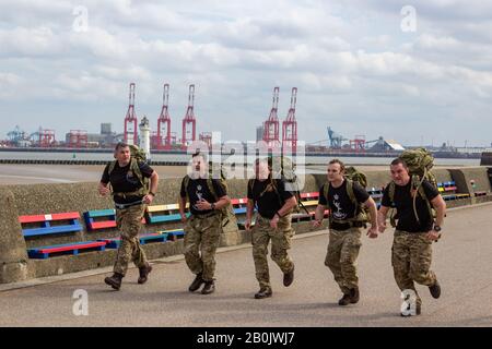 33 Signal Squadron Territorial Army members on the finishing straight of the 2019 Mersey Tunnel 10k run, New Brighton. Stock Photo