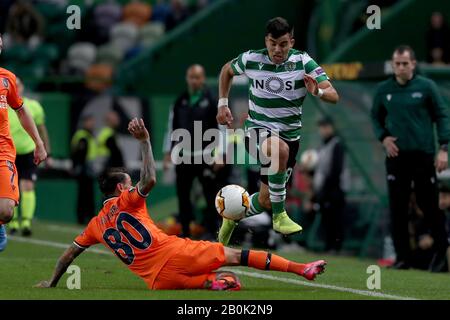 Lisbon, Portugal. 20th Feb, 2020. Marcos Acuna of Sporting CP (R ) vies with Junior Caicara of Istanbul Basaksehir during the UEFA Europa League round of 32 first leg football match between Sporting CP and Istanbul Basaksehir at Alvalade stadium in Lisbon, Portugal, on February 20, 2020. Credit: Pedro Fiuza/ZUMA Wire/Alamy Live News Stock Photo