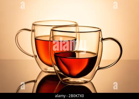 Two double wall glass cups with tea. Stock Photo