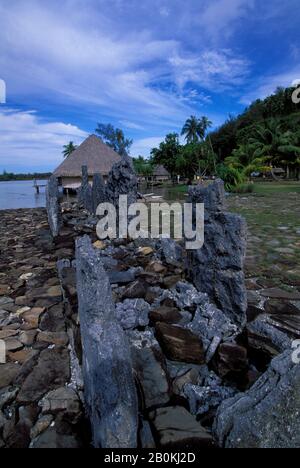 FRENCH POLYNESIA, SOCIETY ISLANDS, HUAHINE, MAEVA VILLAGE, MARAE, MUSEUM IN BACKGROUND Stock Photo