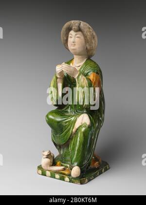 Figure of a Seated Court Lady, China, Tang dynasty (618–907), Date 8th century, China, Earthenware with tri-color (sancai) glaze, H. 14 3/4 in. (37.5 cm); W. 5 5/8 in. (14.3 cm); D. 6 1/16 in. (15.4 cm), Ceramics Stock Photo