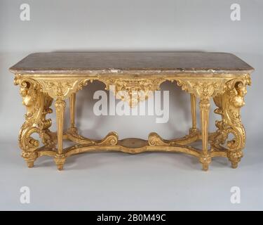 after a design by Charles Lebrun, Side table, French, ca. 1685, French, Carved and gilded oak, fleur-de-pêche marble top, Overall: 31 1/2 × 77 × 32 1/4 in. (80 × 195.6 × 81.9 cm), Woodwork-Furniture Stock Photo