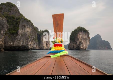 Colorful garland on front of Thai long tail boat at Ao Nang bay Stock Photo
