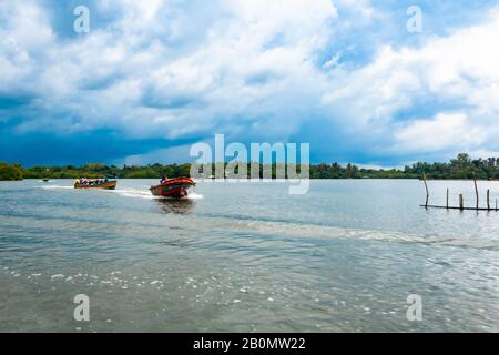 Balapitiya, Sri Lanka. Dec 05, 2018. boats with people. Madu River Safari. very beautiful blue sky Stock Photo