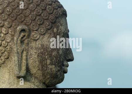 Close-up of a Buddha statue on an upper platform at Borobudur temple (UNESCO World Heritage Site, ninth-century), the largest Buddhist temple in the w Stock Photo