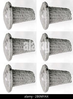 Votive cone with cuneiform inscription of Gudea, Neo-Sumerian, Neo-Sumerian, Date ca. 2090 B.C., Mesopotamia, probably from Girsu (modern Tello), Neo-Sumerian, Clay, Head: 3 1/4 in. (8.3 cm), Total: 3 7/8 in. (9.8 cm), Body: 6 1/2 in. (16.5 cm), End: 4 3/4 in. (12 cm), Length: 2 3/4 in. (7 cm), Clay-Tablets-Inscribed Stock Photo