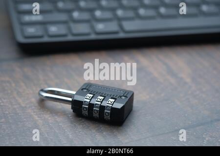 close up of padlock and keyboard on table Stock Photo
